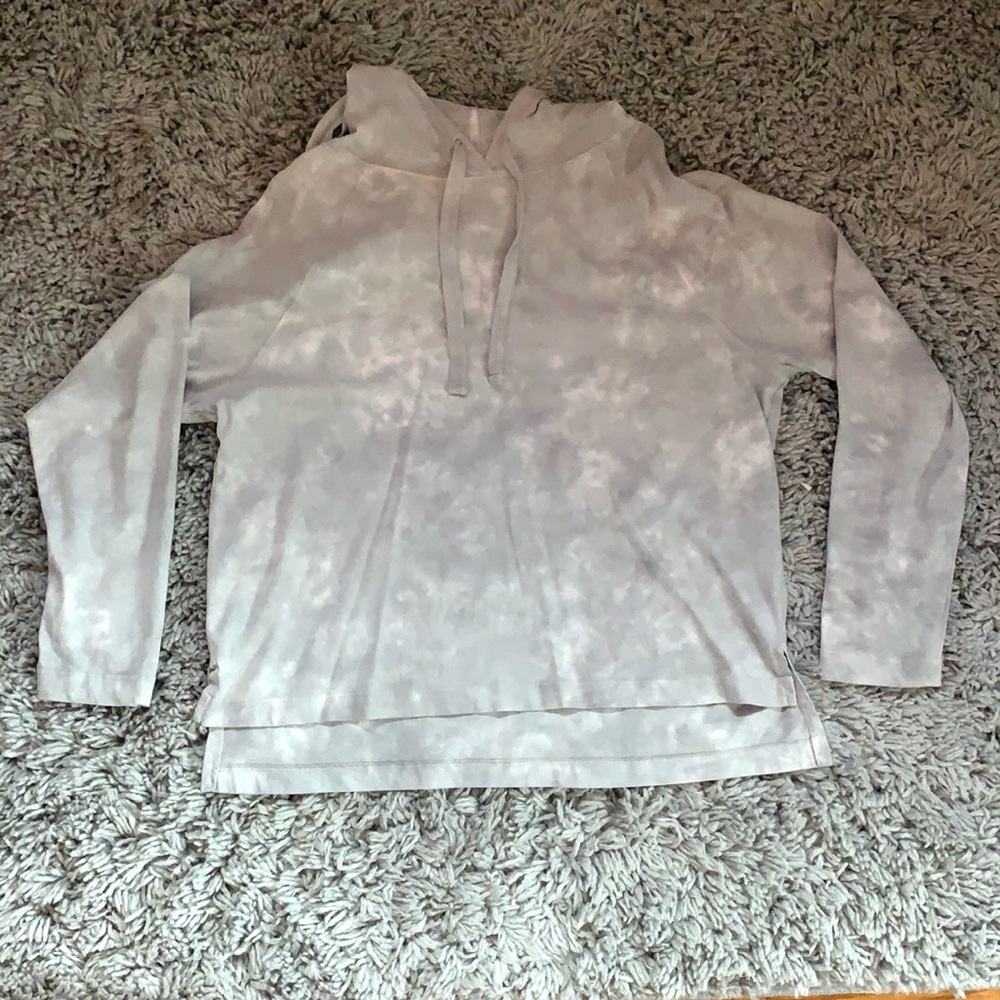 Grey and white tie die hooded sweatshirt.